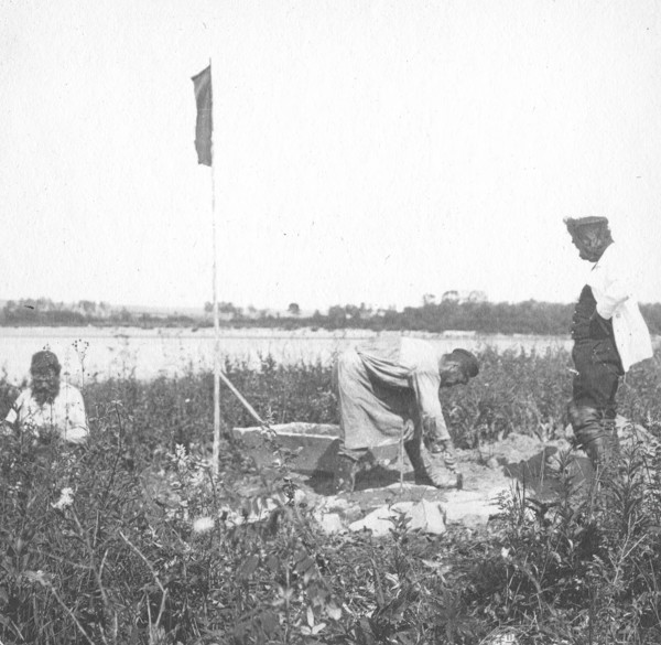The moment of laying the benchmark on the river bank, 1909. Creator: Vladimir Ivanovich Fedorov.