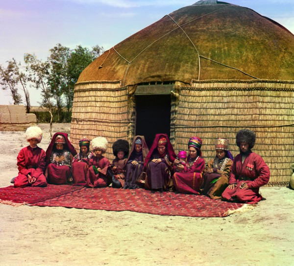 Group of eleven adults and children, seated on a rug, in front of a yurt, between 1905 and 1915. Creator: Sergey Mikhaylovich Prokudin-Gorsky.