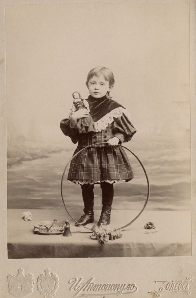 Portrait of a girl with a hoop and a doll, 1900. Creator: I. Antonopulo.