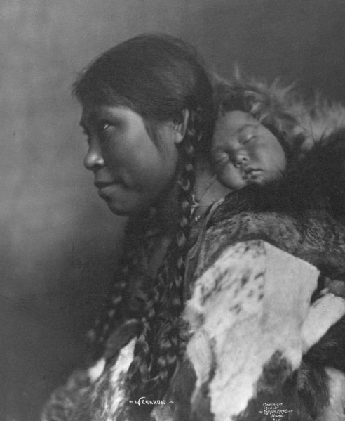 Eskimo mother and child , c1905, printed (1923?). Creator: Lomen Brothers.