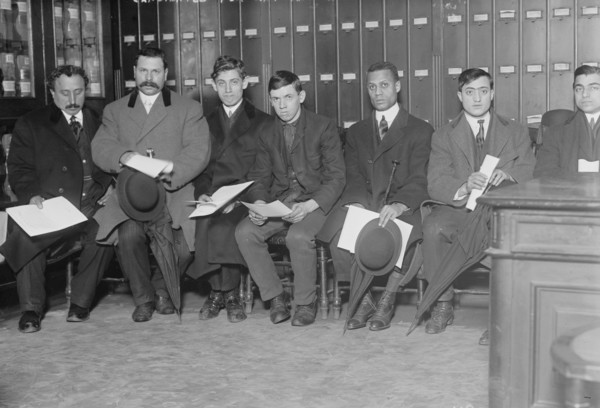 Candidates for naturalization seated with papers, 1910. Creator: Bain News Service.