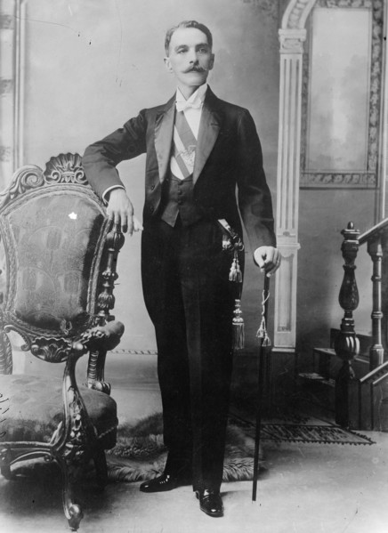 C.E. Restrepo posing next to chair, with cane, 1910. Creator: Bain News Service.