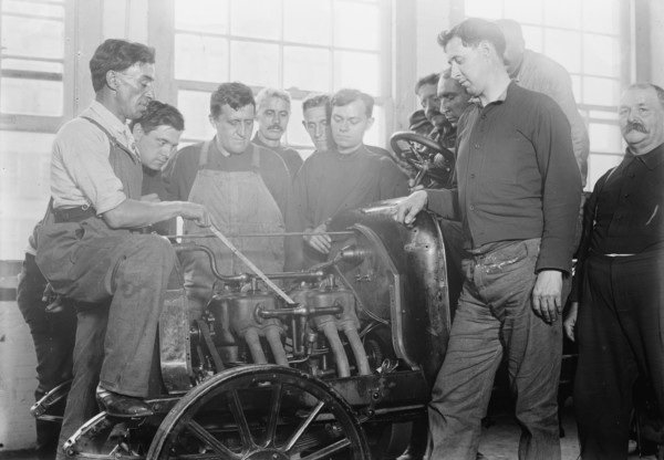 Firemen studying auto motor, between c1910 and c1915. Creator: Bain News Service.