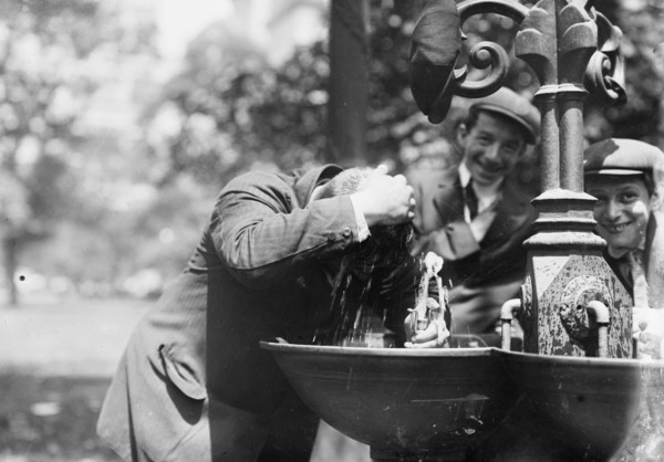 Cooling his head - N.Y. on hot day, between c1910 and c1915. Creator: Bain News Service.