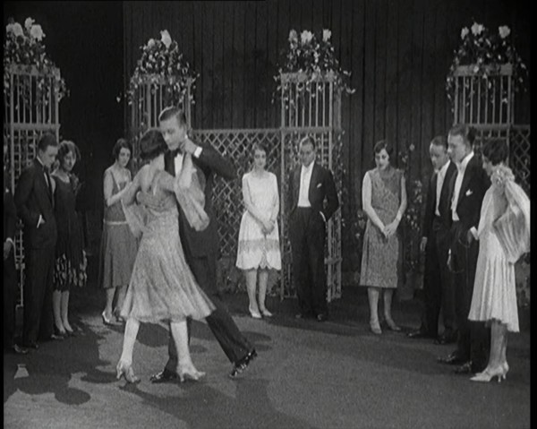 A Group of People Dancing the Charleston. One Female Civilian is Rubbing Her Legs is Pain, 1926. Creator: British Pathe Ltd.
