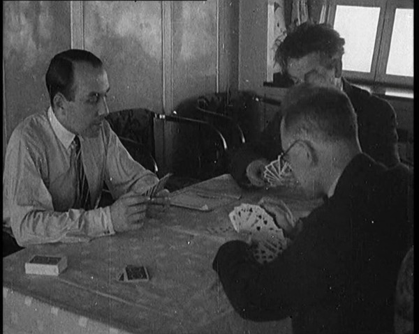 Male Civilians Playing Cards in Gondola of the Zeppelin, 1929. Creator: British Pathe Ltd.