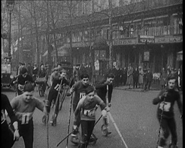 Racers Skiing Through Paris, France on Wheeled Skis, 1929. Creator: British Pathe Ltd.
