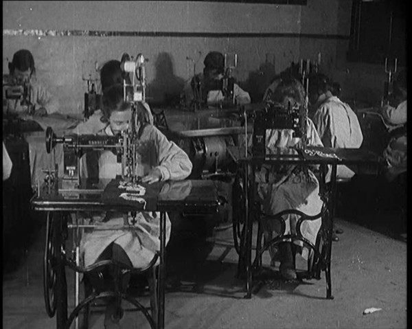Young Female Civilians Operating Sewing Machines in an Arts Class, 1920. Creator: British Pathe Ltd.