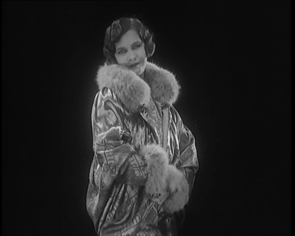 Female Civilian Modelling a Glamorous Fur Trimmed Coat, 1920. Creator: British Pathe Ltd.