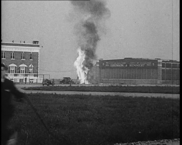 Plume of Flame Emitting from the ‘Bellanca’ Crash as People Attend to Wreckage, 1933. Creator: British Pathe Ltd.
