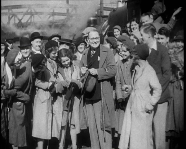 People Standing at  a Train Station, 1933. Creator: British Pathe Ltd.