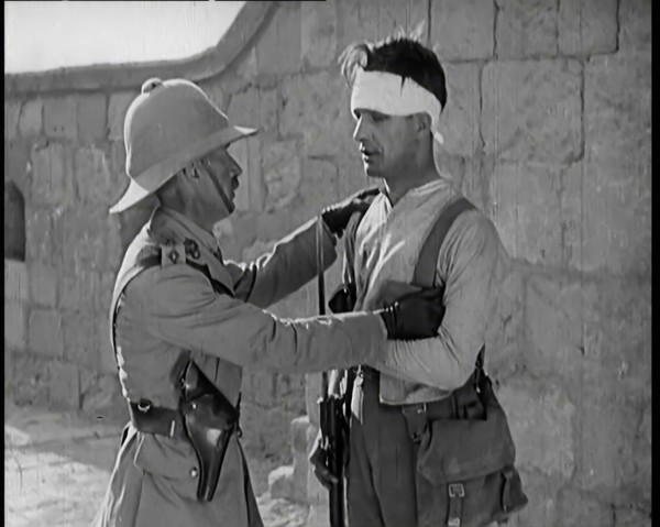 Scene from a Film: Male Actor Playing a Survivor from the Battle Being Questioned..., 1920s. Creator: British Pathe Ltd.