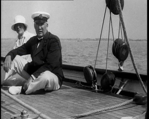 A Man and a Woman Sitting on the Deck of a Yacht at  Cowes, 1933. Creator: British Pathe Ltd.