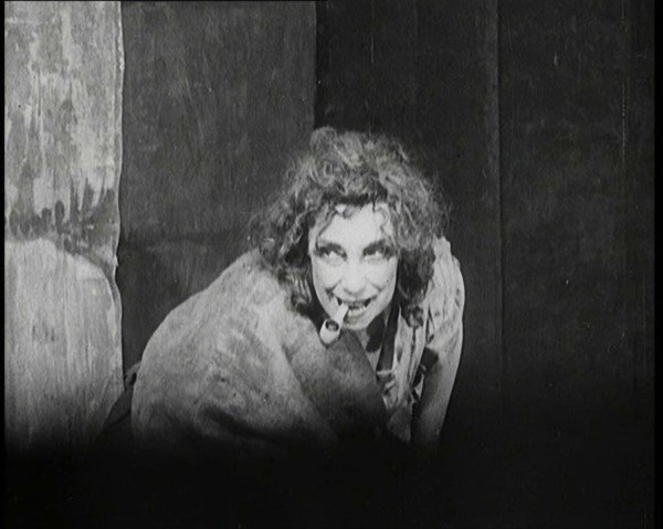 Helen Tree Performing in Heavy Makeup and Smoking a Pipe, 1922. Creator: British Pathe Ltd.
