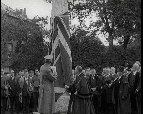 British Officer Pulling Down Union Flag to Reveal a Memorial Obelisk, 1920. Creator: British Pathe Ltd.