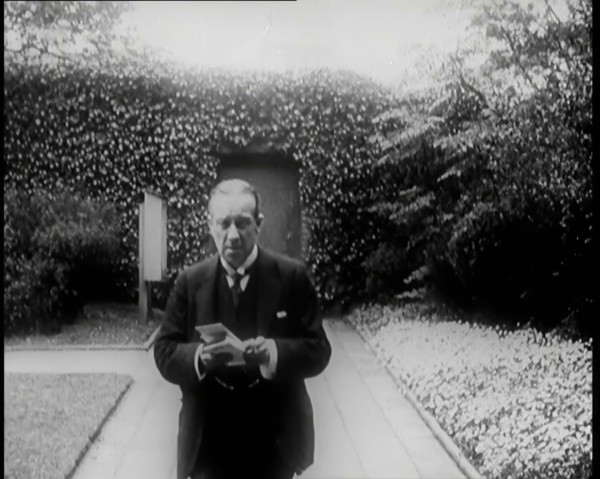 Prime Minister of Britain, Stanley Baldwin, Walking in the Gardens at Chequers Whilst Reading, 1926. Creator: British Pathe Ltd.