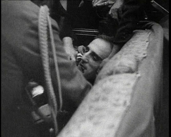 People Inspecting a Corpse, 1934. Creator: British Pathe Ltd.