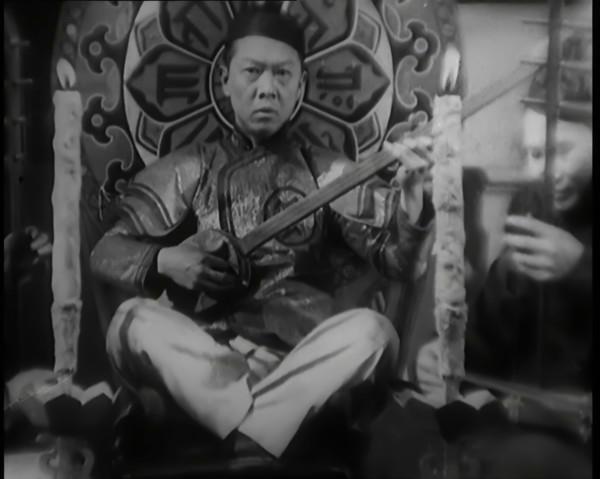 Scene from the Film 'Piccadilly': Male Actor Playing a Lute, 1920s. Creator: British Pathe Ltd.