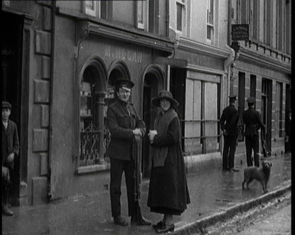 People Walking Along a Desolate Street in Ireland, 1921. Creator: British Pathe Ltd.