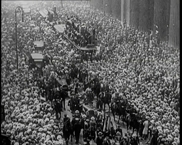A Large Crowd Watching a Ticker Tape Parade in New York City, 1926. Creator: British Pathe Ltd.