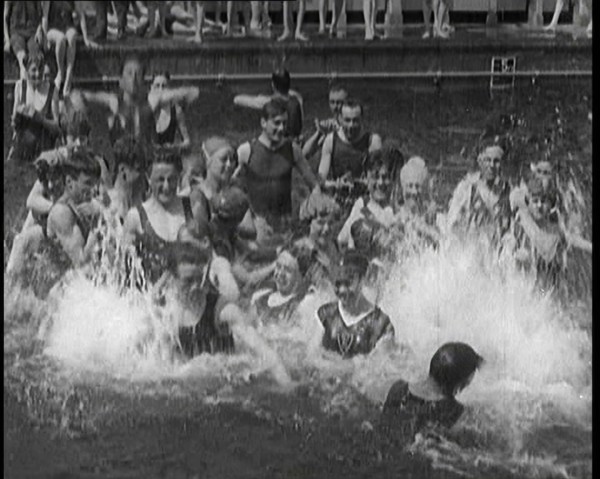 British People Splashing and Playing in the Chiswick Open Air Baths, 1920. Creator: British Pathe Ltd.