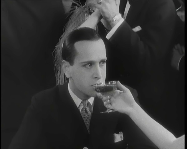 Scene from the Film 'Champagne': Betty Balfour in a Nightclub Drinking Champagne and Giving...,1920s Creator: British Pathe Ltd.