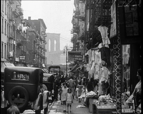 Street View of Street Market Selling Clothes in New York City, 1932. Creator: British Pathe Ltd.