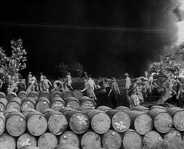 Commonwealth Troops Walking Through a Flaming Supply Dump, 1941. Creator: British Pathe Ltd.