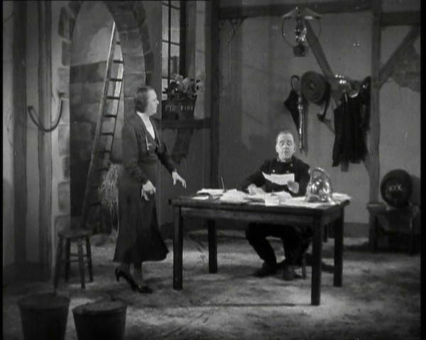 Comedian Robb Wilton On Set Playing a Fire Brigade Officer and Sitting at a Desk With Papers...,1938 Creator: British Pathe Ltd.
