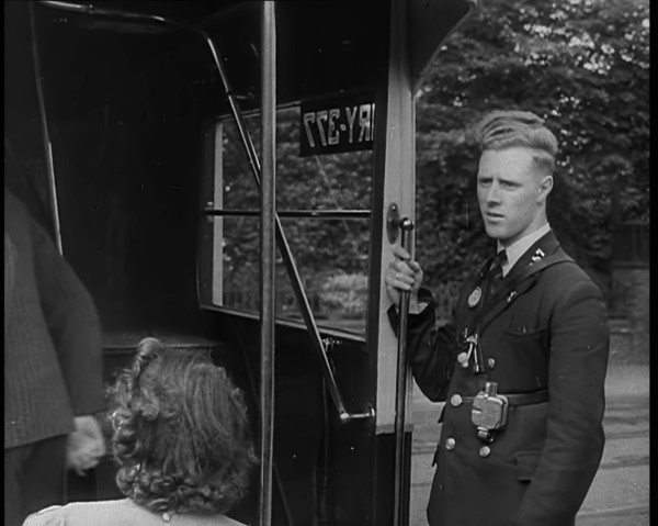 Bus conductor, 1940. Creator: British Pathe Ltd.
