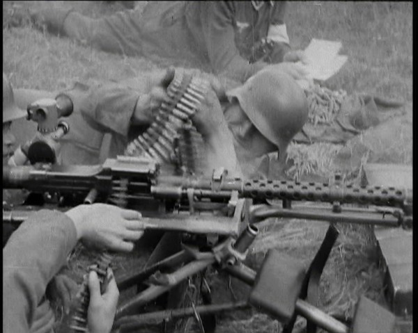 Two German Soldiers Firing a Machine Gun..., 1937. Creator: British Pathe Ltd.
