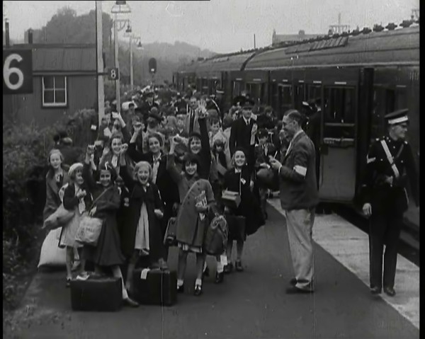 British Male and Female Evacuees on the Platform of a Small Station in the British Country..., 1939. Creator: British Pathe Ltd.