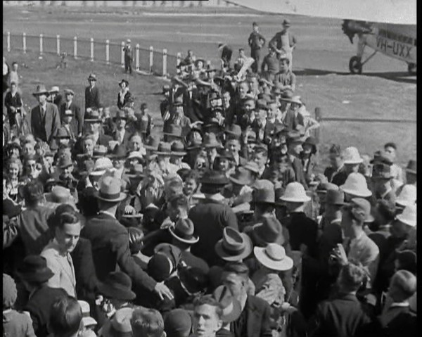 Jean Batten Walking Through a Crowd, 1930s. Creator: British Pathe Ltd.
