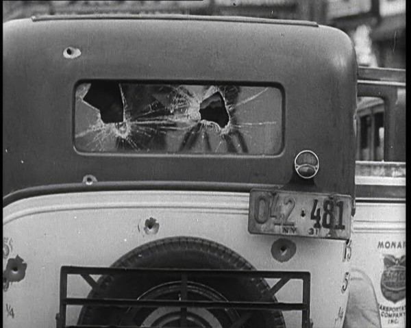 Bullet Holes Through the Back Window of a Car, 1932. Creator: British Pathe Ltd.