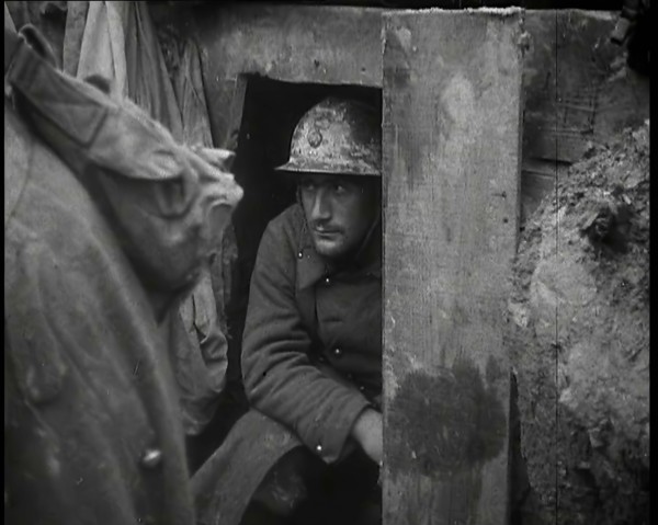 A Male French Soldier Sitting in a Doorway Dug into the Side of a Trench, 1939. Creator: British Pathe Ltd.