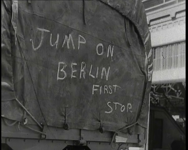 Chalk Graffiti on the Tarpaulin Covering a Lorry Reading 'JUMP on BERLIN FIRST STOP', 1939. Creator: British Pathe Ltd.