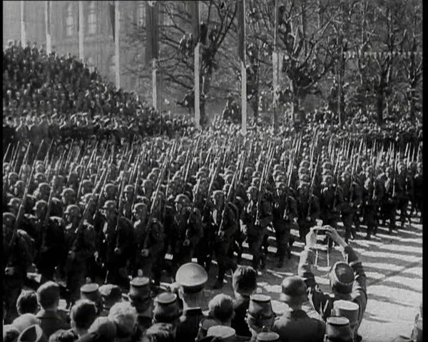 A Formation of Male German Soldiers Marching Past a Raked Platform of Officials on a Vienna..., 1938 Creator: British Pathe Ltd.
