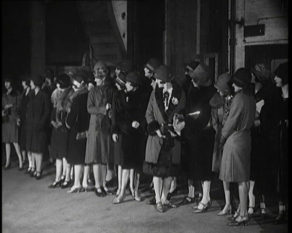 The Producer Julian Wylie Inspecting Young Prospective Female Stage Performers Standing..., 1920s. Creator: British Pathe Ltd.