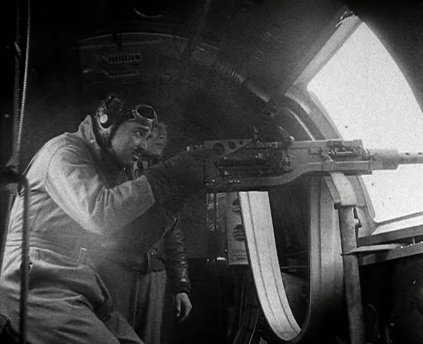 Actor Clark Gable Firing a Machine Gun Out of a Warplane, 1943-1944. Creator: British Pathe Ltd.