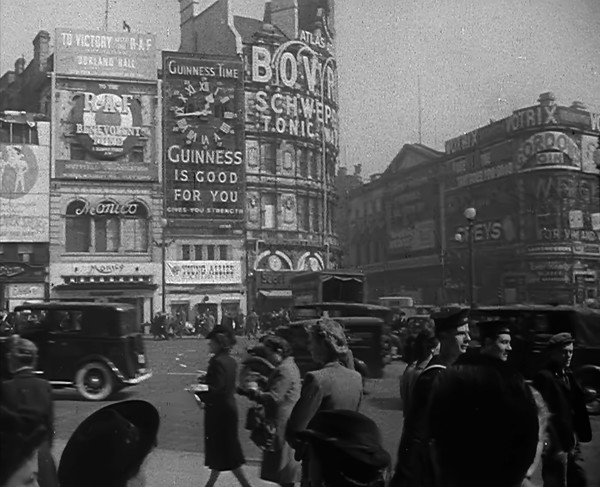 People and Traffic Moving Across Piccadilly Circus, 1943. Creator: British Pathe Ltd.