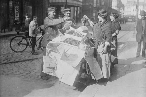 German soldiers buying fruit, Belgium, 1915. Creator: Bain News Service.