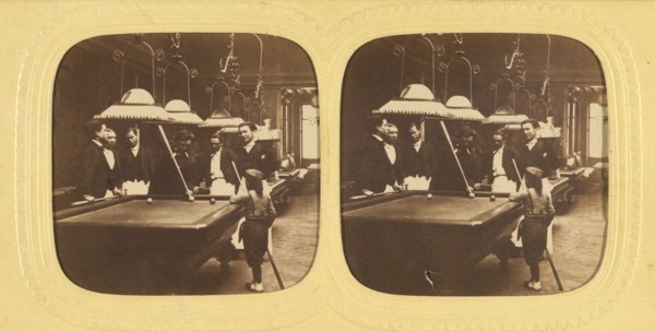 Men playing billards, one little boy holding a cue stick, about 1868. Creator: E Lamy.