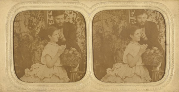 Unidentified couple: bearded man holding a single piece of fruit with a woman holding..., about 1865 Creator: Unknown.