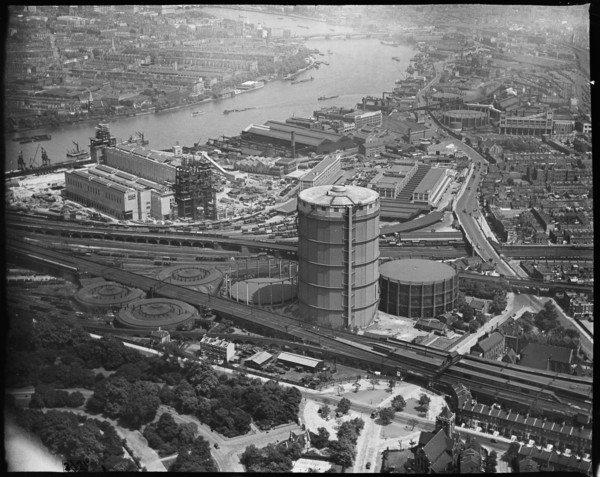 Battersea Power Station under construction and the Gas Holder Station, Nine Elms, London, c1930s. Creator: Arthur William Hobart.