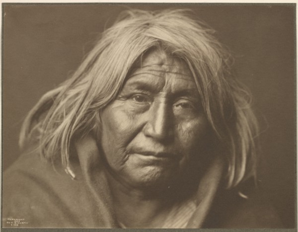 An Apache, 1903. Creator: Edward Sheriff Curtis.