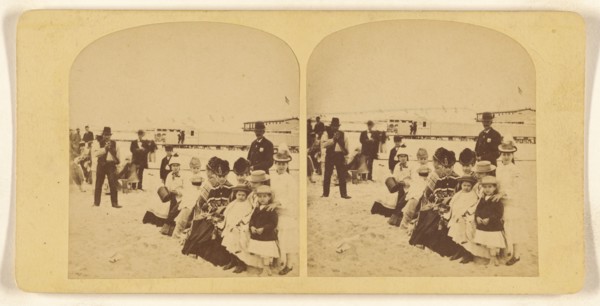 Family portrait at the beach, probably New York, about 1878. Creator: Halls.