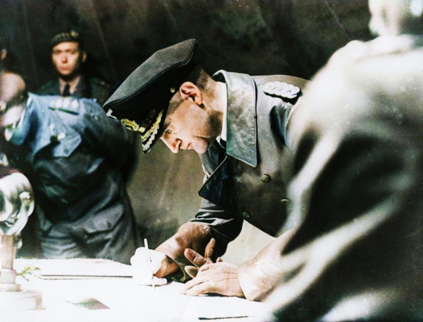Rear-Admiral Gerhard Wagner signing the German surrender document ending World War II, 1945.