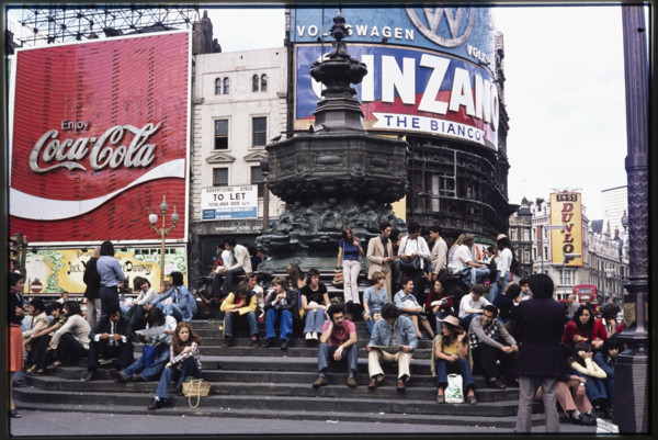 Crowds on the steps at the base of the Shaftesbury Memorial Fountain, or Eros, at Piccadilly