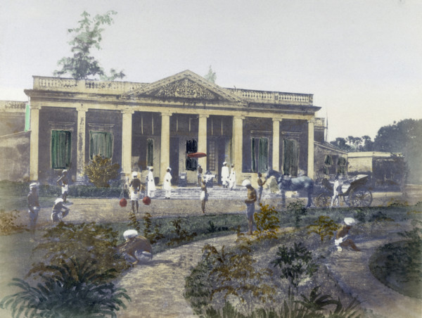 Residence of a European, India, 1850. Hand-coloured photograph showing a 'sahib' reclining on his
