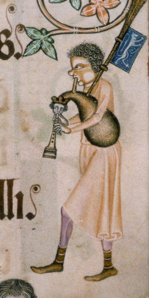 A bagpiper, c1300-c1340. His cheek is puffed out with the effort of playing the instrument. The